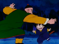 Tien fights Goku in a forest