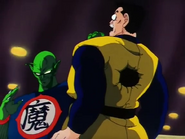 King Piccolo holding King Furry's guard after impaling him