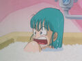 Bulma in the bath yelling at Goku to stay away
