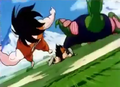 Goku and Piccolo are knocked away by the attack