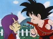 Arale talking to Goku