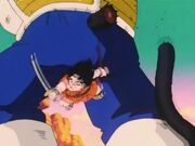 Yajirobe cuts off Vegeta's tail