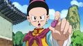 Chi-Chi holding a bean