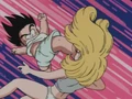 Goku gives Launch a swift kick in her face