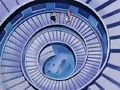 Piccolo and Super Buu walking up a spiral staircase inside the Lookout