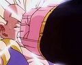 Super Buu punches Gotenks in the face