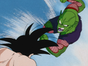 Piccolo charges towards Goku