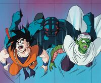 Garlick Jr. golpeando a Goku y Piccolo