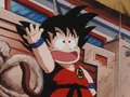 Goku waves to the audience and his friends