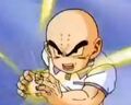 Krillin charges a Ki Blast