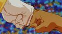 Goku's and Uub's hands clashing each other