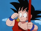 Goku with the Cat Bell in one hand and the Power Pole on the other hand