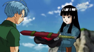 Future Mai giving Future Trunks his clothes and sword