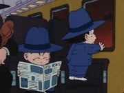 Krillin reading a paper that says "USA News"