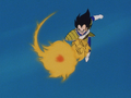 Vegeta fires a charged ki blast at Goku