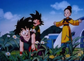 Gohan giving Goten a piggy-back ride as Chi-Chi watches