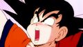 Goku rises his arms while groaning