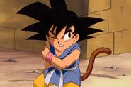 Son Goku niño (GT) con cola.