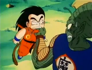 Goku biting King Piccolo's finger