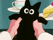 Dr. Brief holding Scratch while talking about Vegeta