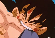 Goku bites Baby Vegeta's arm