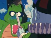 Pilaf threatening an alligator with a knife while asking for the whereabouts of Master Roshi