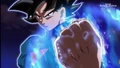 Ultra Instinct Sign Goku focusing energy into his fist in the Super Dragon Ball Heroes anime