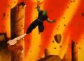 Piccolo fires a Ki Blast while Garlic Jr.'s fortress collapses
