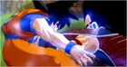 Raditz punches Goku in the stomach