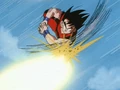 Goku deflects Tien's ki blast with a Double Axe Handle
