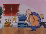 Master Roshi throws fake stone at Krillin