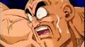 Nappa feeling the pain of Goku's punch