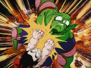 Goku using the Feet Kamehameha to double punch Piccolo Jr.