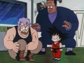 Goku laughs at General White after kicking him in the shin