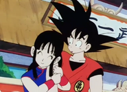 Chi-Chi holding onto Goku's arm