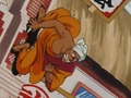 Nam preparing to launch at Goku after being thrown at a wall