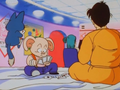 Puar, Yamcha, and Oolong playing cards while Bulma searches for Dragon Balls