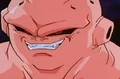 Super Buu smiles as he threatens Goku