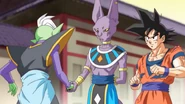 Beerus intercepts Zamasu's attack on Goku after having been exposed