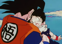 Goku healing Gohan's broken neck with a Senzu Bean