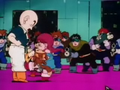 Emi kicks Krillin in the shin and runs away