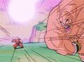 Nappa throws his Bomber DX at Krillin