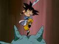 GT Goku ready to use a similar attack against a statue