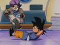 Goku doing sit-ups while Trunks reads Cosmo