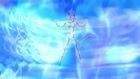 A Super Saiyan God silhouette appears as energy is channeled into Goku