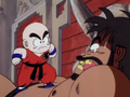 Krillin leaps onto Bacterian's chest