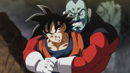 Goku is bear hugged by Tupper