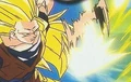 Super Saiyan 3 Goku deflects Majin Buu's Ki Blasts