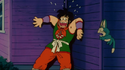 Yamcha runs and huddles against a wall in fear