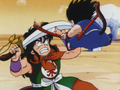 Yamcha uses his sword to block Goku's Power Pole